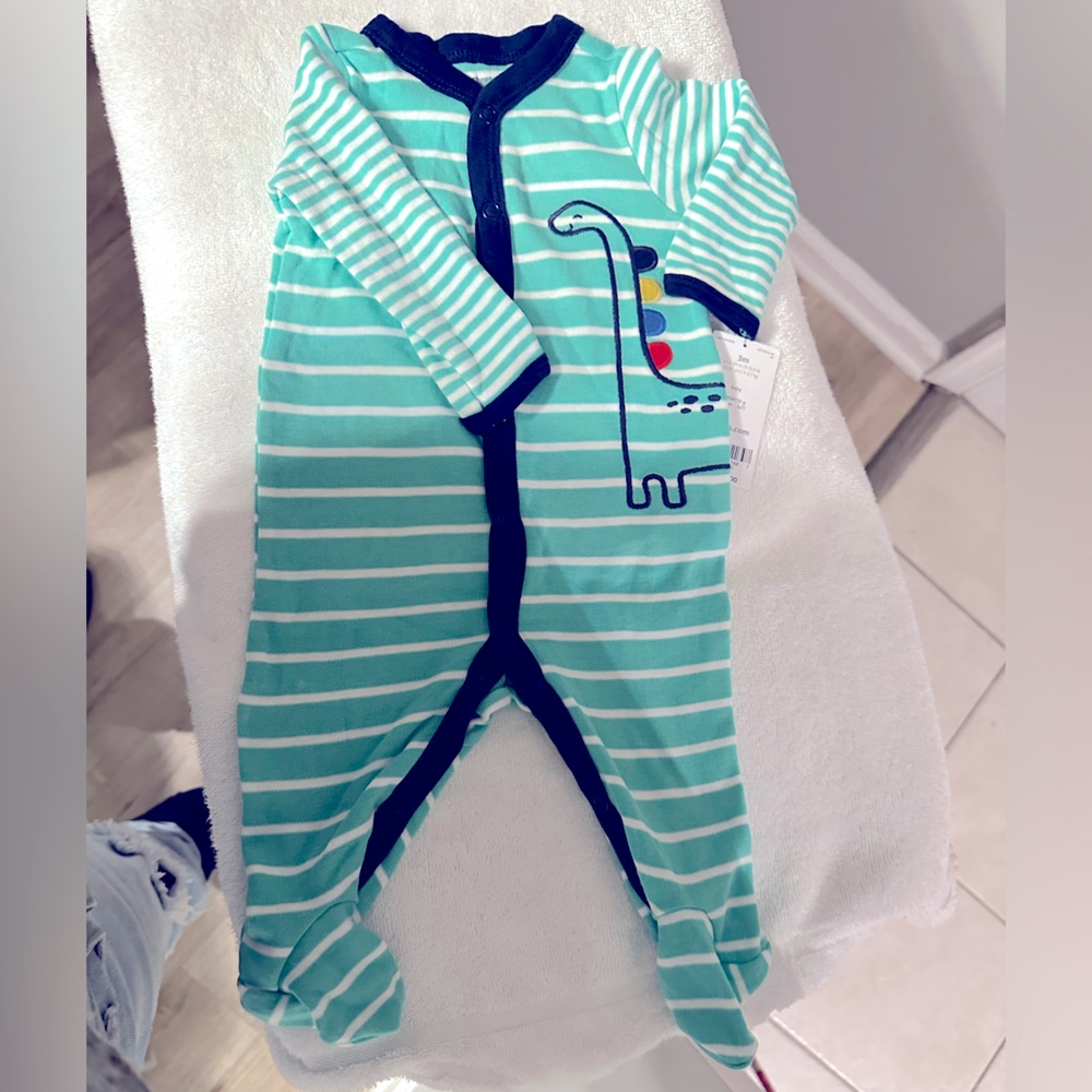 Brand new with tags Carter’s Dinosaur Footie pajamas